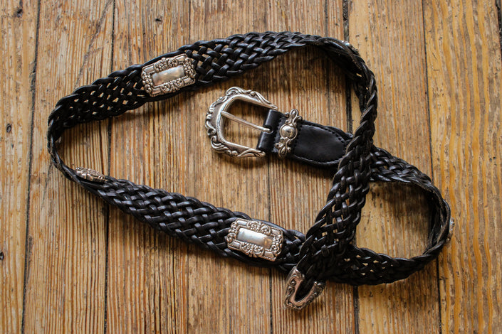 woven black leather belt with silver hardware details