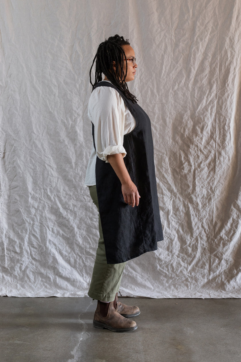 Kiki pinafore in black mid weight linen